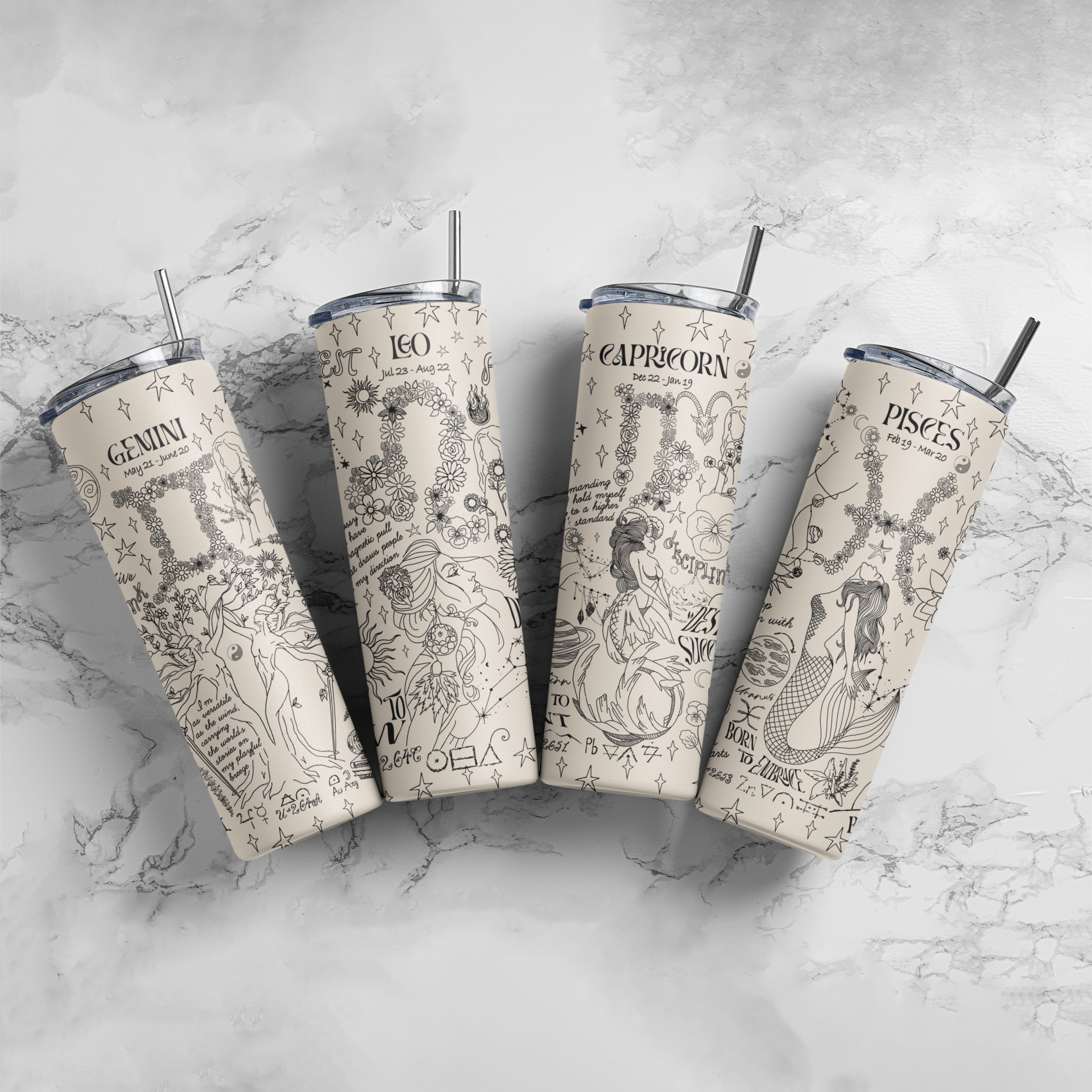 a group of four travel mugs sitting on top of a marble counter