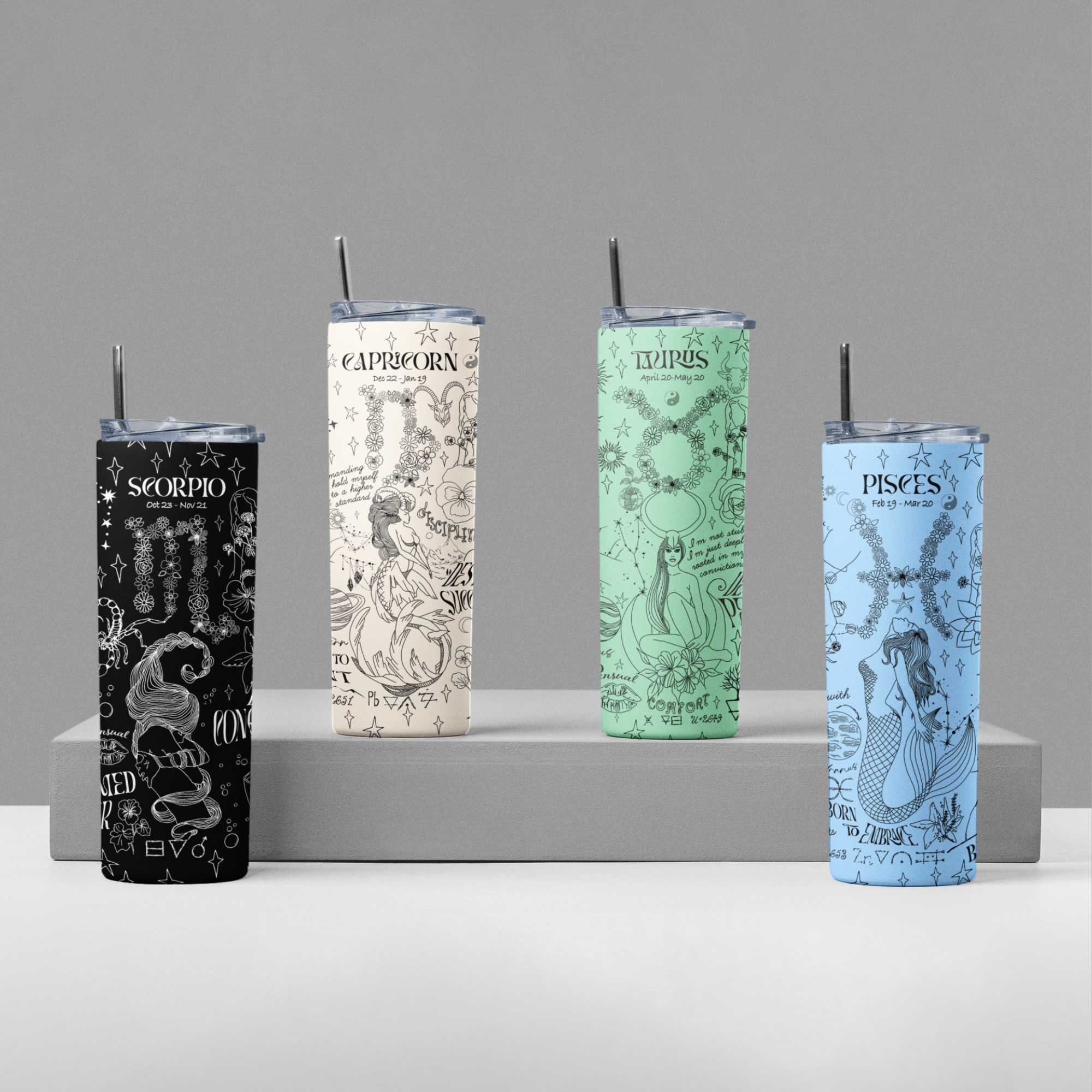 a row of four different colored candles on a shelf