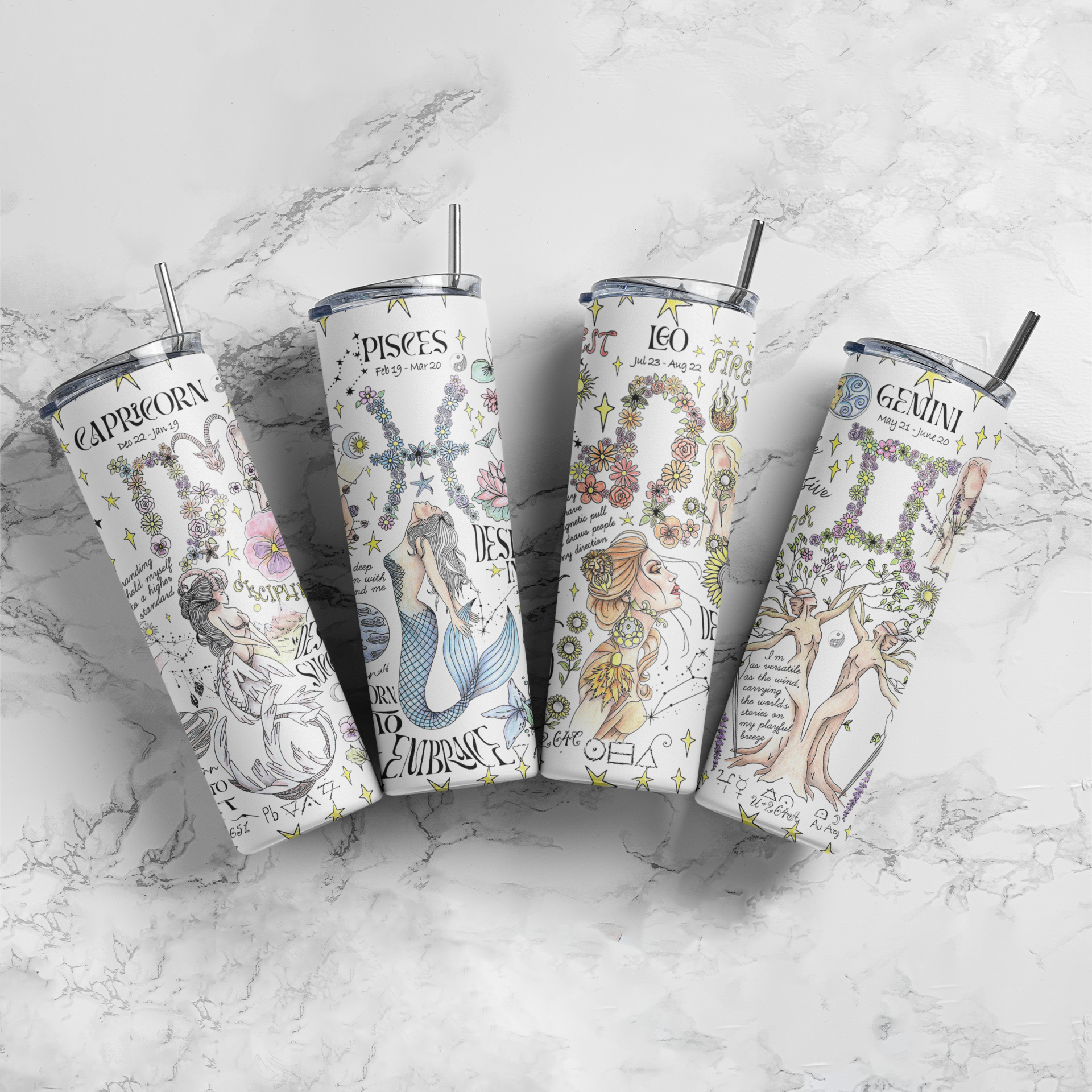 a set of four disney tumblers sitting on top of a marble counter